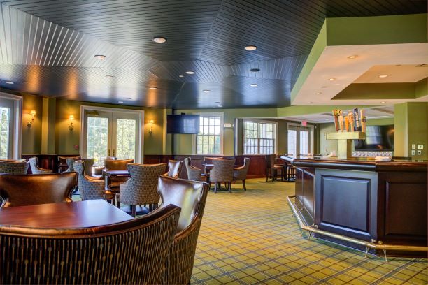 Large wooden bar located in the Pub Room